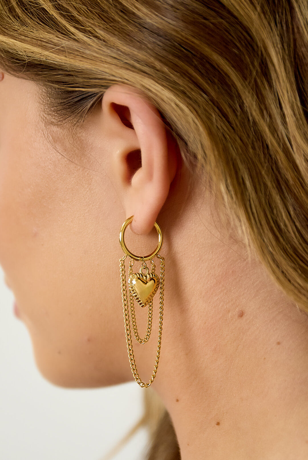Hoop earrings with hanging chains and heart